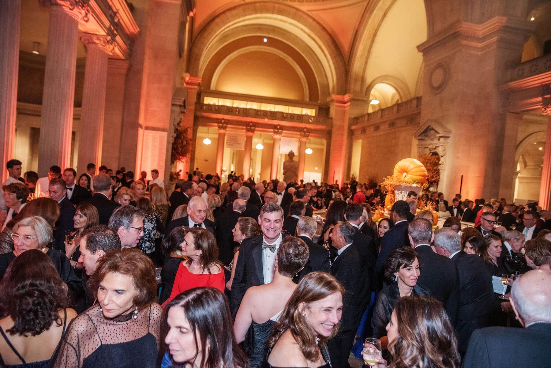 A crowded room of guests at an NYU gala event
