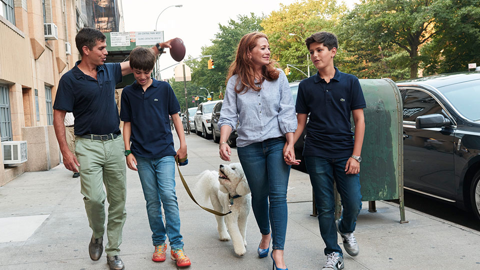 NYU Patient Family - Andy, Jonah, Allyson, and Samson Wiener take a walk with their dog, Taco, near their home in the Upper West Side.