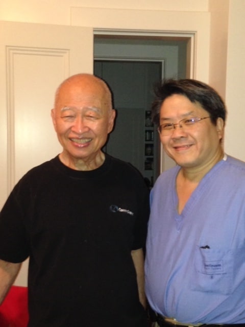 Dr. John Wang with a patient at NYU Langone