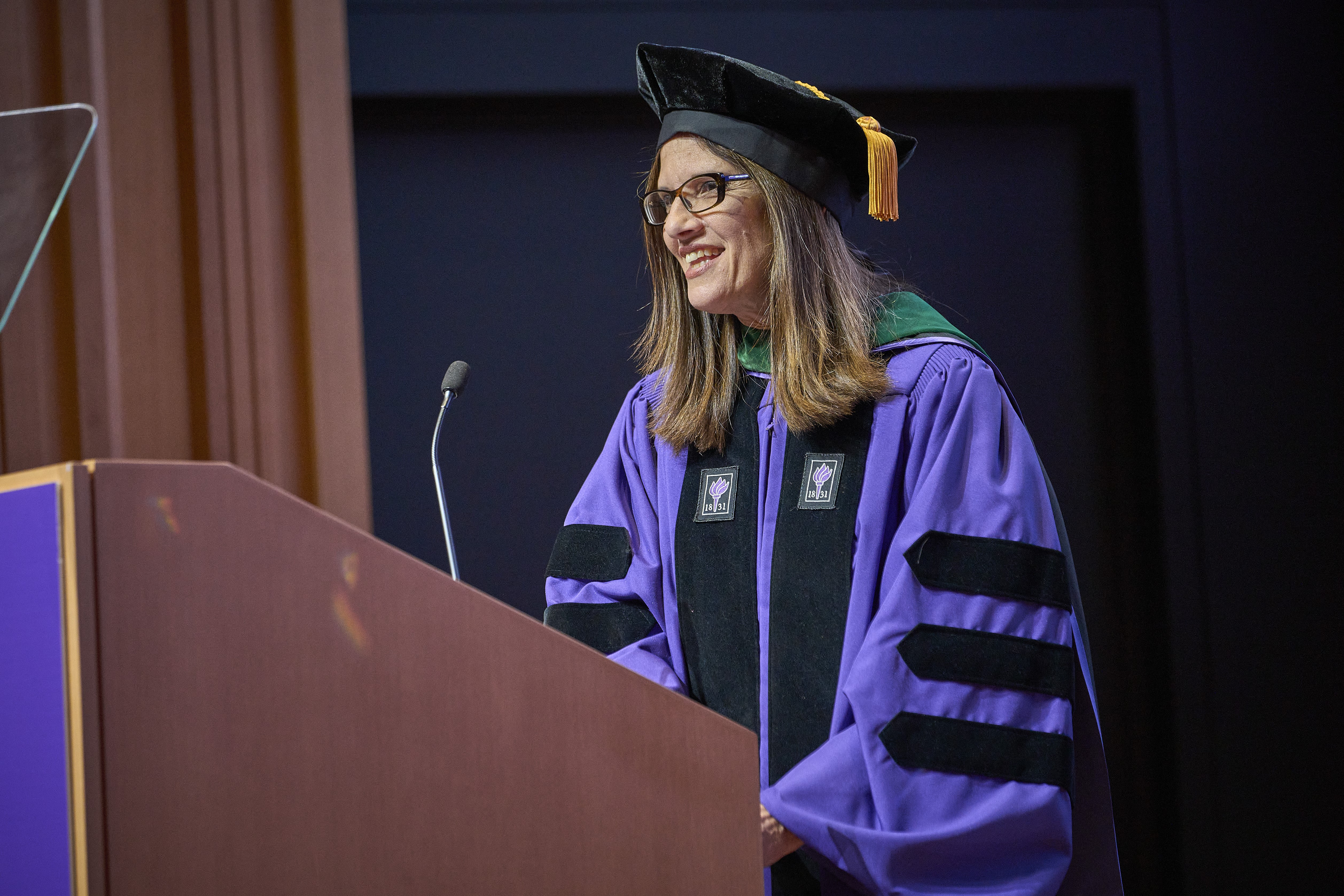 Speaker in academic regalia