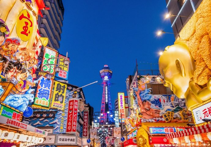Shinsekai The Renowned Culinary District Of Osaka Offers A High Rise View From The Tsutenkaku TowerShinsekaiNew World Is An Old Neighbourhood Located Next To South Osaka Citys Downtown Minami Area